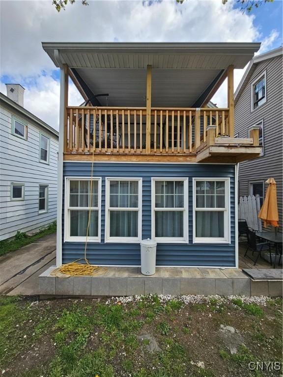 back of property with a patio and a balcony