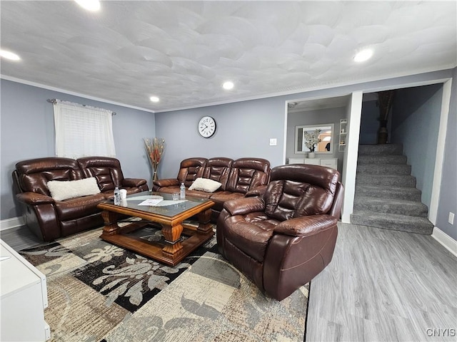 living area featuring crown molding, stairs, wood finished floors, baseboards, and recessed lighting