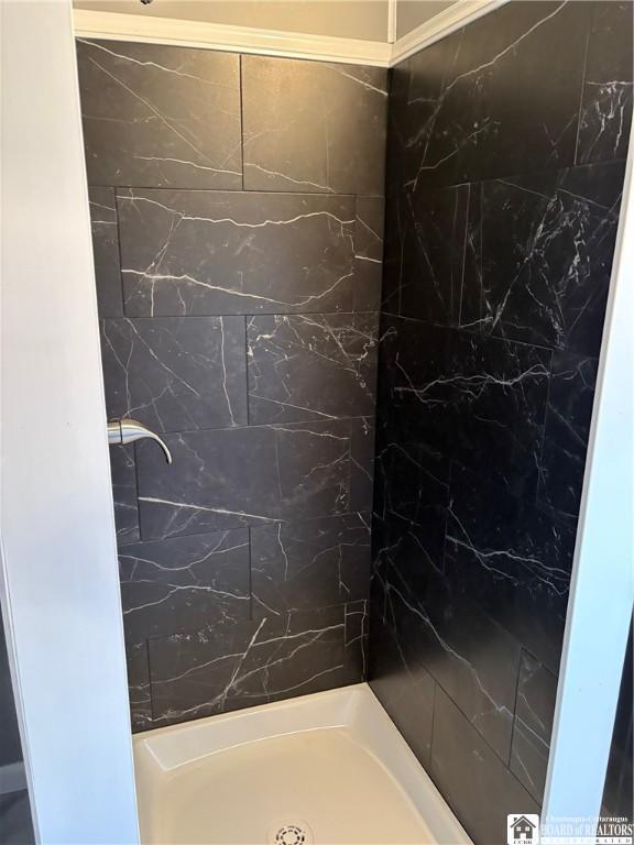 full bathroom featuring walk in shower