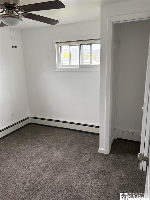 unfurnished bedroom with carpet floors and a ceiling fan