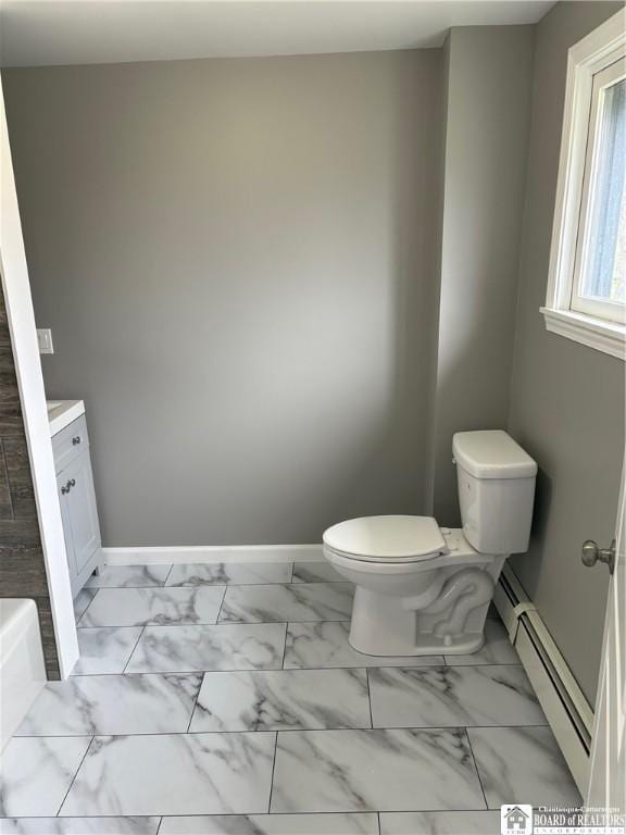 bathroom with vanity, marble finish floor, toilet, baseboards, and baseboard heating