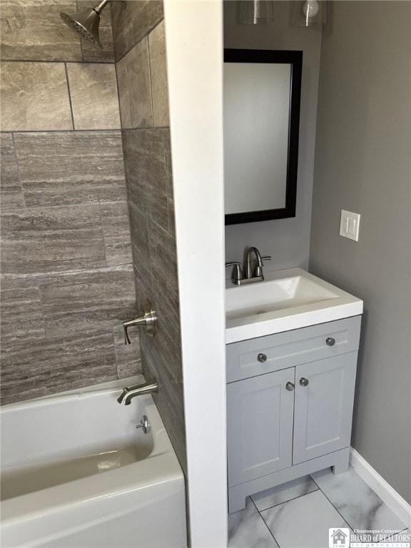 bathroom featuring shower / bath combination, vanity, baseboards, and marble finish floor