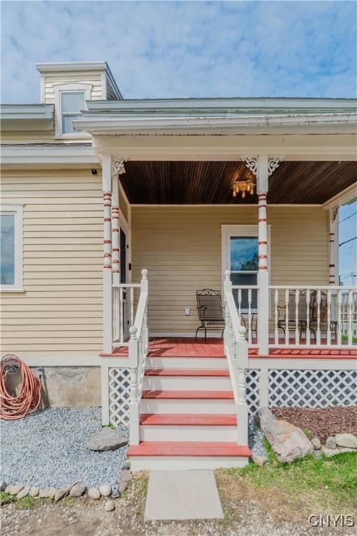 doorway to property with a porch