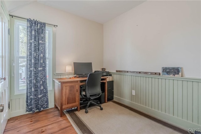 office area featuring wainscoting and wood finished floors
