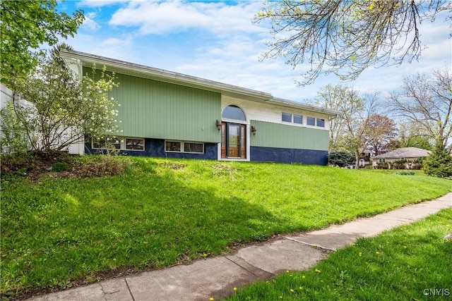 back of property featuring a yard