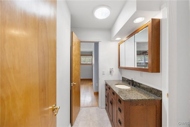 bathroom with baseboards and vanity