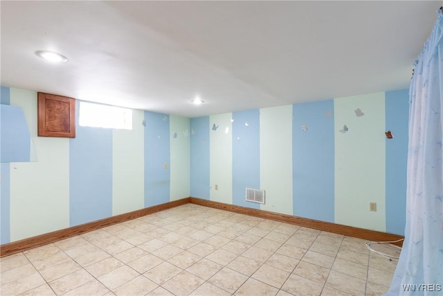 spare room featuring recessed lighting and visible vents