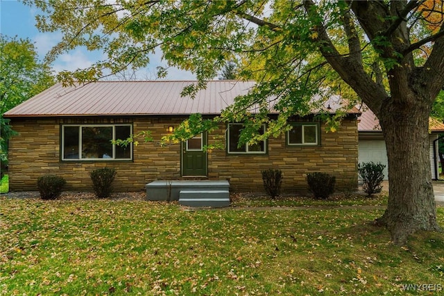 38 Carol Ave, Pomfret, NY 14063 - rear view of house featuring stone siding, a lawn, and metal roof