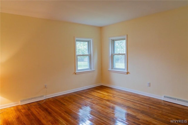 38 Carol Ave, Pomfret, NY 14063 - spare room featuring wood finished floors, a baseboard radiator, and baseboards