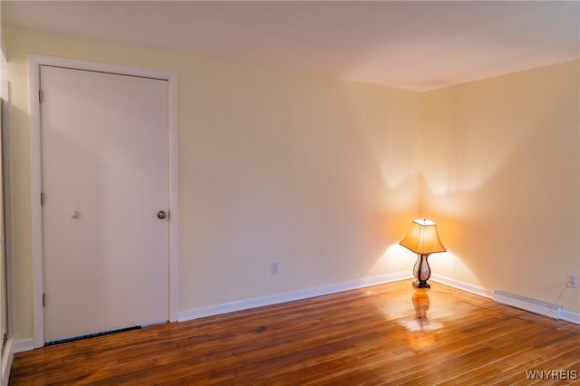 38 Carol Ave, Pomfret, NY 14063 - unfurnished room featuring wood finished floors, baseboards, and a baseboard radiator