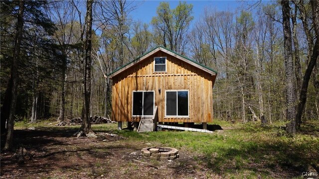 11 Lake Pennock Dr, Orwell, NY 13144 - view of outdoor structure with a fire pit and a view of trees