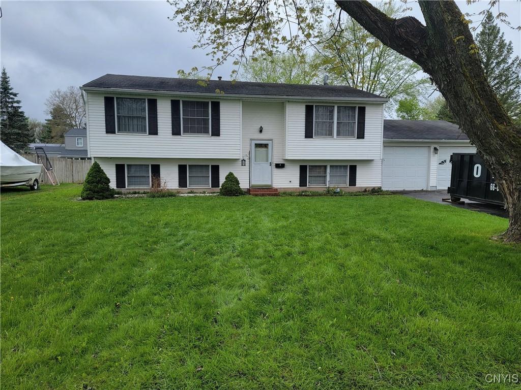 2 Orange Tree Ln, Clay, NY 13090 - bi-level home with entry steps and a garage