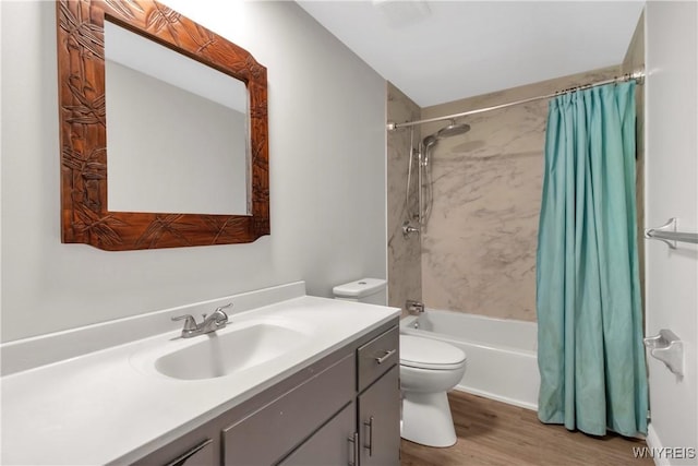 full bathroom featuring vanity, toilet, wood finished floors, and shower / bath combo with shower curtain