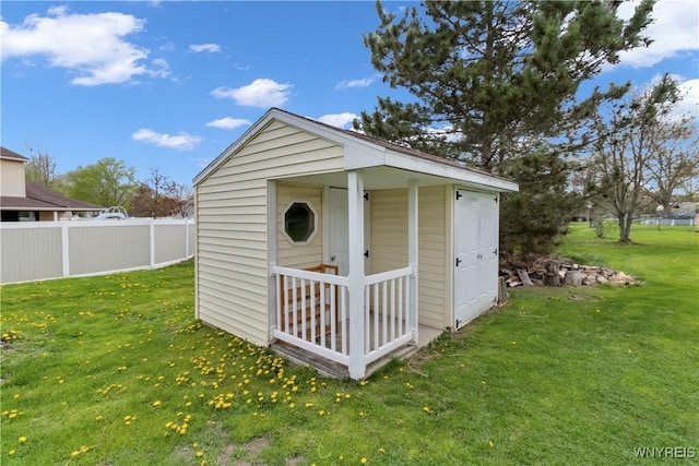 view of shed with fence