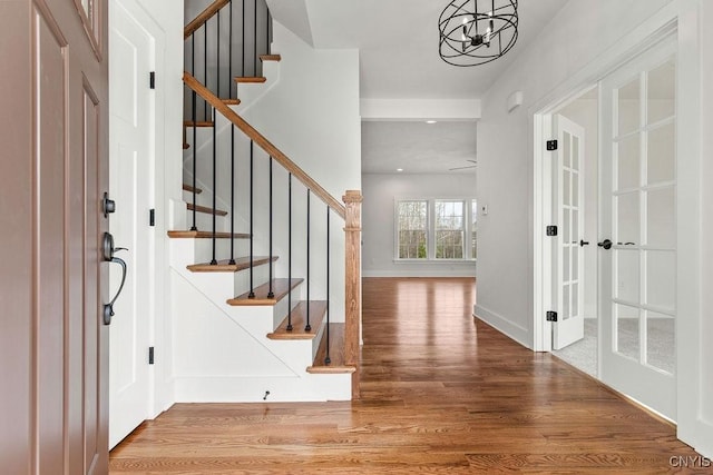 LOT379TIMBERBANKS 8032 Forest Rdg, Lysander, NY 13027 - entryway with an inviting chandelier, stairs, recessed lighting, baseboards, and wood finished floors