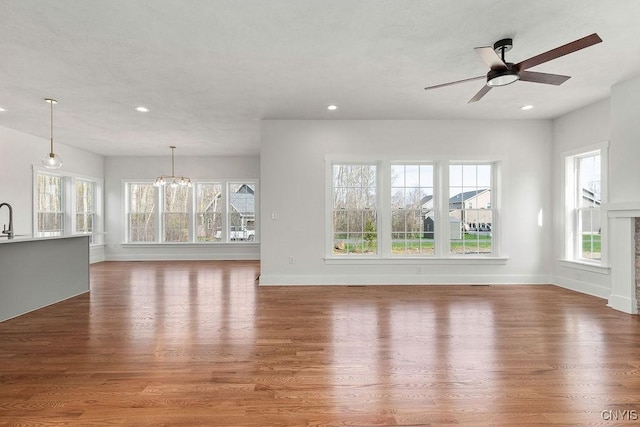 LOT379TIMBERBANKS 8032 Forest Rdg, Lysander, NY 13027 - unfurnished living room with recessed lighting, a wealth of natural light, and wood finished floors