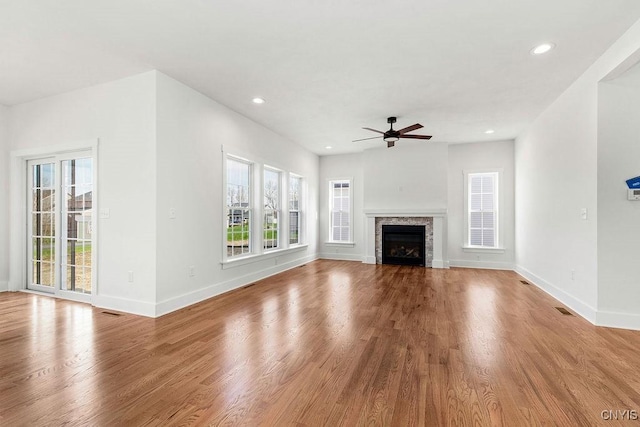 LOT379TIMBERBANKS 8032 Forest Rdg, Lysander, NY 13027 - unfurnished living room with ceiling fan, plenty of natural light, and wood finished floors