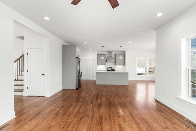 LOT379TIMBERBANKS 8032 Forest Rdg, Lysander, NY 13027 - unfurnished living room featuring baseboards, ceiling fan, dark wood-style flooring, and visible vents