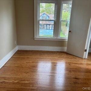 118 Ruhamah Ave, Onondaga, NY 13205 - spare room with baseboards, wood finished floors, and a wealth of natural light