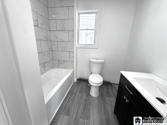 184 W 2nd St, Dunkirk-City, NY 14048 - full bath with vanity, baseboards, toilet, and wood finished floors