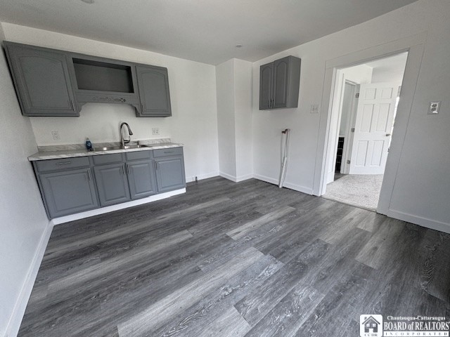 184 W 2nd St, Dunkirk-City, NY 14048 - kitchen featuring gray cabinets, dark wood-style flooring, a sink, baseboards, and light countertops