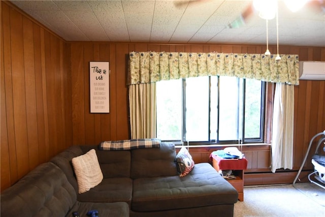carpeted living area featuring wooden walls, a wall unit AC, a ceiling fan, and a wealth of natural light