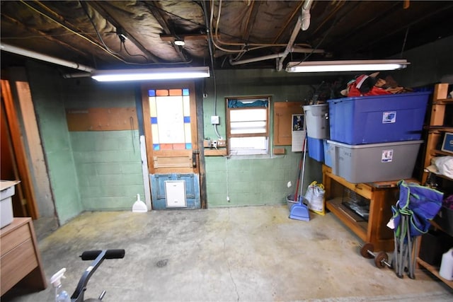 below grade area featuring concrete block wall