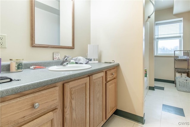 bathroom featuring vanity and baseboards