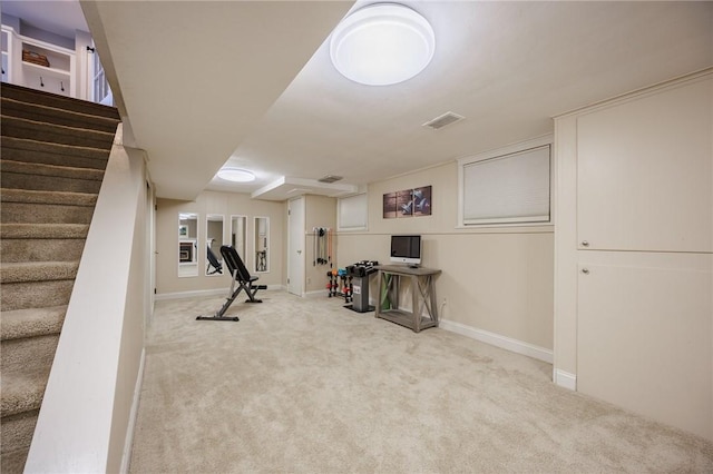 exercise area featuring carpet flooring, baseboards, and visible vents