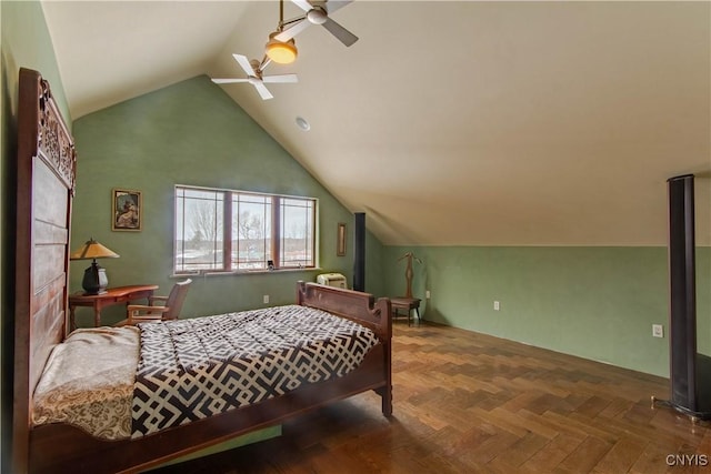 bedroom with a ceiling fan and lofted ceiling