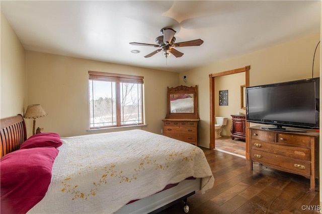 bedroom with dark wood-style flooring, a ceiling fan, and ensuite bathroom