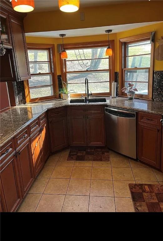 2 Park Pl, Delhi, NY 13753 - kitchen featuring stainless steel dishwasher, decorative backsplash, plenty of natural light, a sink, and light tile patterned floors