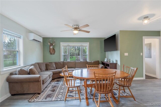 216 Harry Bryant Rd, Amboy, NY 13493 - living room featuring a wall mounted air conditioner, healthy amount of natural light, a ceiling fan, and baseboards