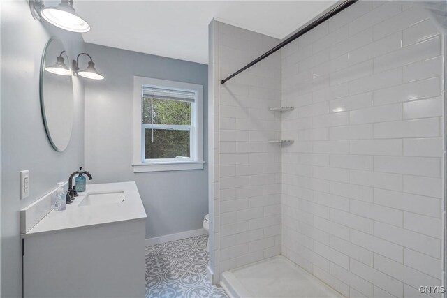 216 Harry Bryant Rd, Amboy, NY 13493 - bathroom featuring vanity, toilet, tile patterned floors, and tiled shower