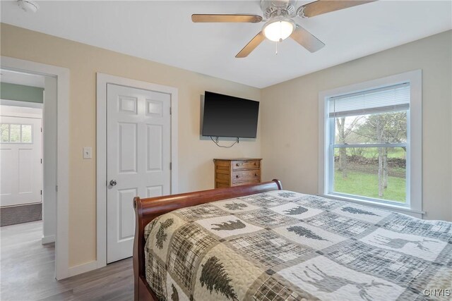 216 Harry Bryant Rd, Amboy, NY 13493 - bedroom featuring wood finished floors, baseboards, and ceiling fan