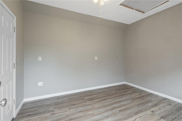 216 Harry Bryant Rd, Amboy, NY 13493 - empty room with wood finished floors, baseboards, and attic access