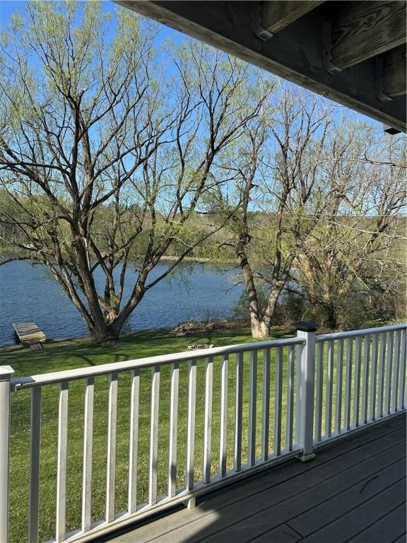 deck featuring a water view and a yard