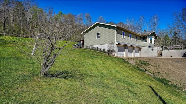 1029 Barden, Eldred, PA 16731 - view of side of property with a yard, fence, driveway, and a garage