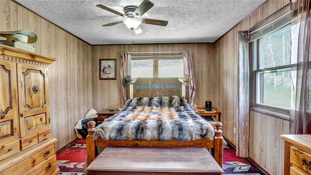 1029 Barden, Eldred, PA 16731 - bedroom featuring wooden walls, multiple windows, and a textured ceiling