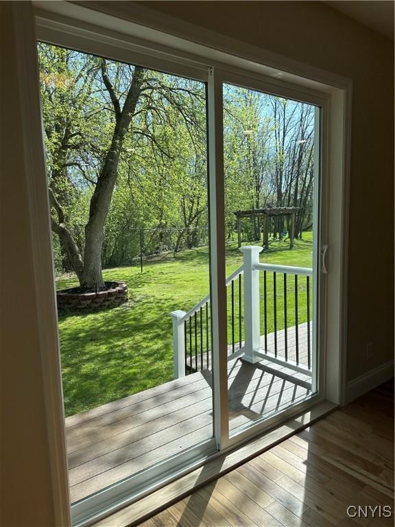 entryway with wood finished floors