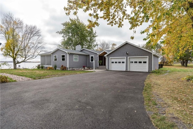 25524 County Route 57, Lyme, NY 13693 - single story home with a garage and a chimney