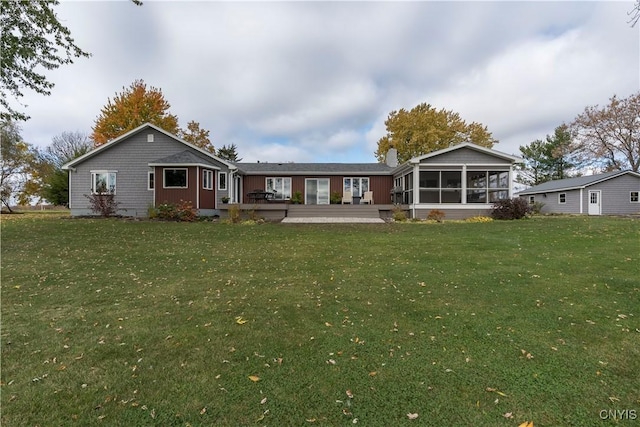 25524 County Route 57, Lyme, NY 13693 - back of house featuring a yard, a sunroom, and a deck