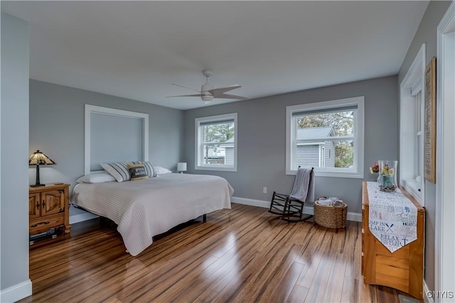 25524 County Route 57, Lyme, NY 13693 - bedroom with a ceiling fan, baseboards, and wood finished floors