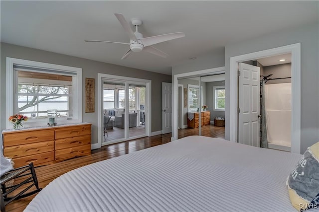 25524 County Route 57, Lyme, NY 13693 - bedroom with dark wood-style flooring, multiple windows, and access to exterior