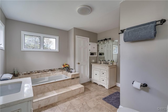 25524 County Route 57, Lyme, NY 13693 - bathroom with vanity, tile patterned floors, and a garden tub