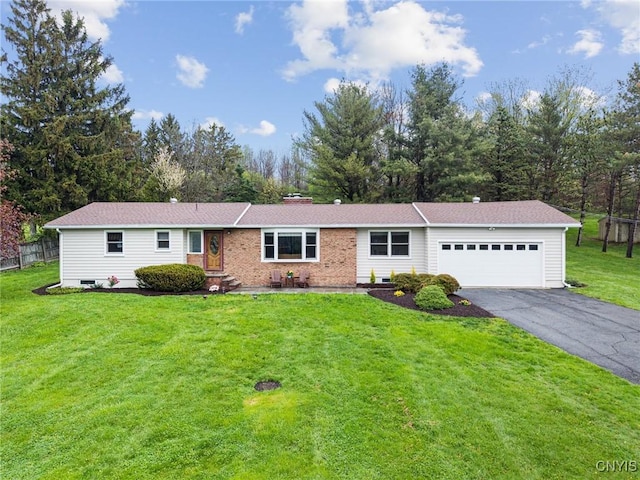 single story home featuring a garage and driveway