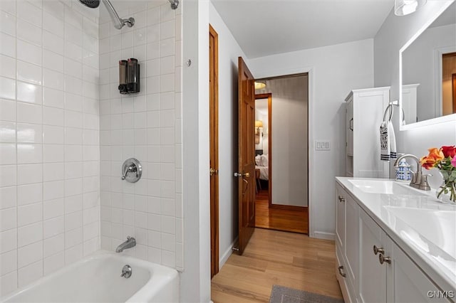 2380 E Lake Rd, Spafford, NY 13152 - full bath with wood finished floors, shower / bath combination, double vanity, and baseboards