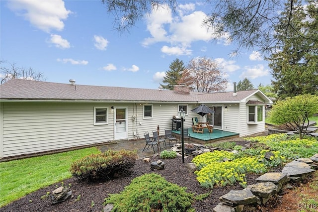 2380 E Lake Rd, Spafford, NY 13152 - rear view of property featuring a chimney, a patio, and a shingled roof