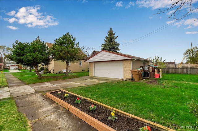 exterior space featuring fence, an outbuilding, a garden, and a garage