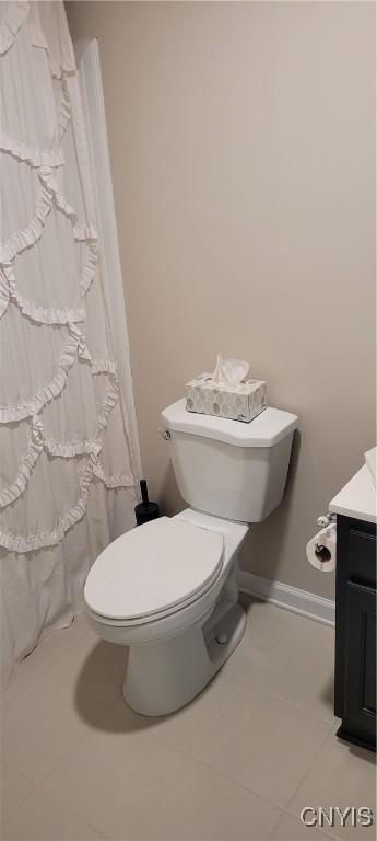 full bath featuring toilet, a shower with shower curtain, tile patterned flooring, and vanity